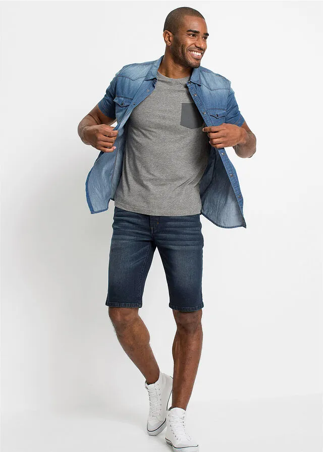 Dark blue slim fit stretch denim Bermuda shorts.