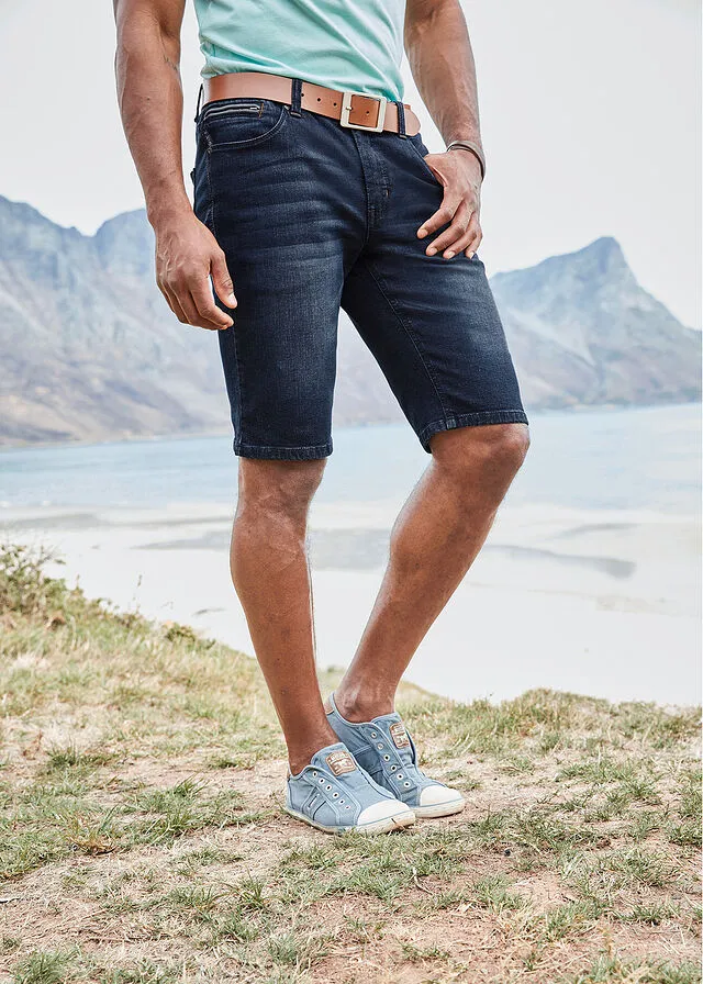 Dark blue slim fit stretch denim Bermuda shorts.