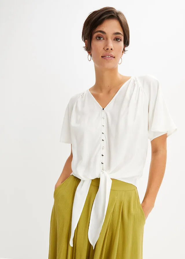 Dark orange blouse.