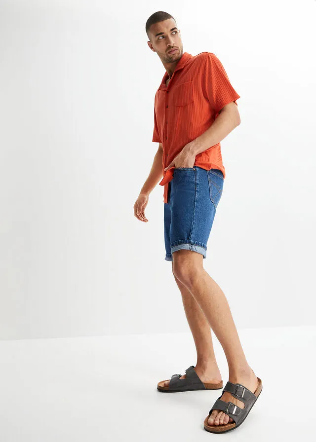 Denim Bermuda shorts with elastic side waistband in classic blue denim.