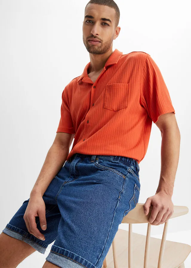 Denim Bermuda shorts with elastic side waistband in classic blue denim.