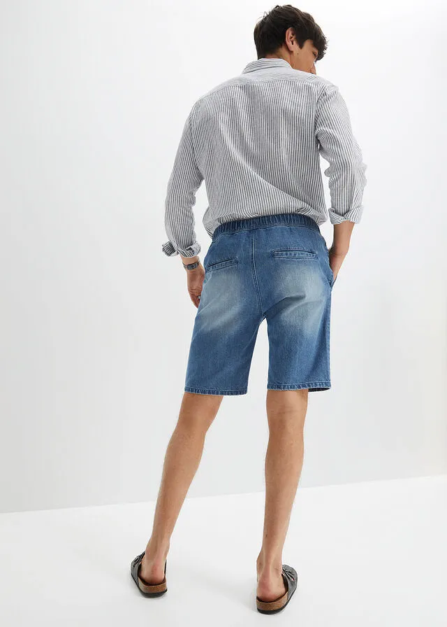 Denim Bermuda shorts with stretch waistband and distressed regular fit.
