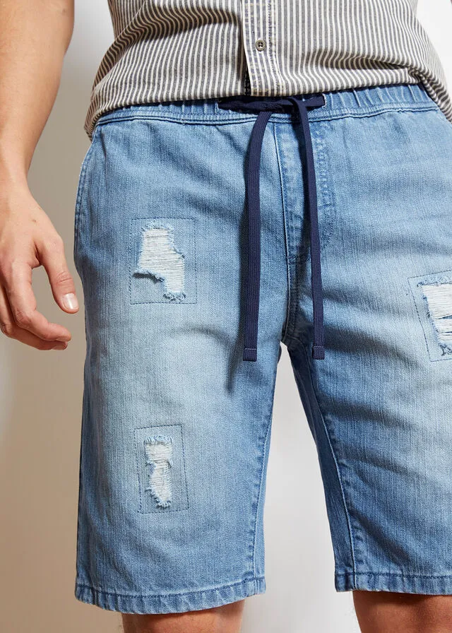 Denim Bermuda shorts with stretch waistband and distressed regular fit.