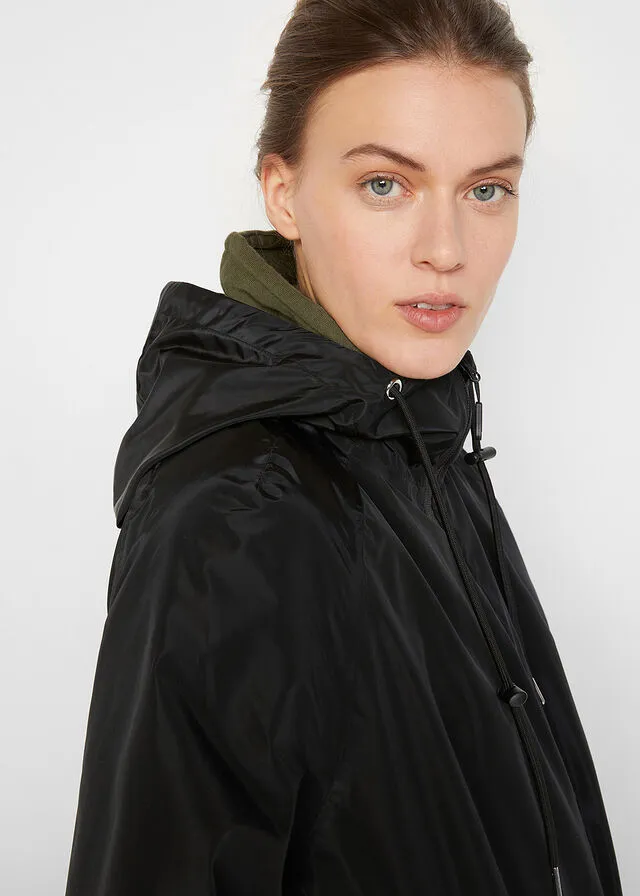 Functional and wide oversize waterproof black coat.
