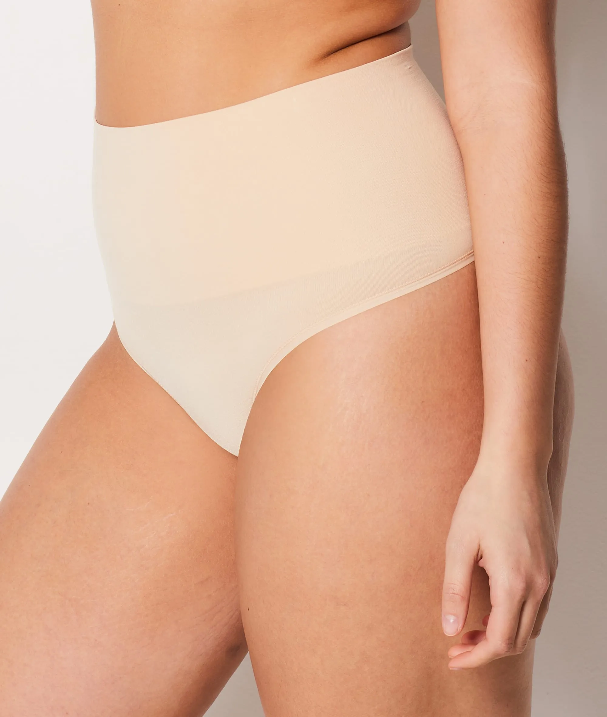 HIGHWAISTED THONG. MEDIUM SUPPORT POWER BY ETAM IN BEIGE. ETAM