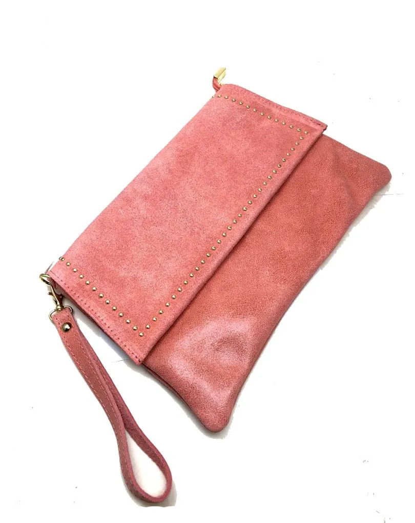 Light coral leather bags with gold details on the flap.