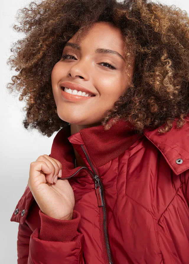 Long quilted jacket with diamond stitch in black.