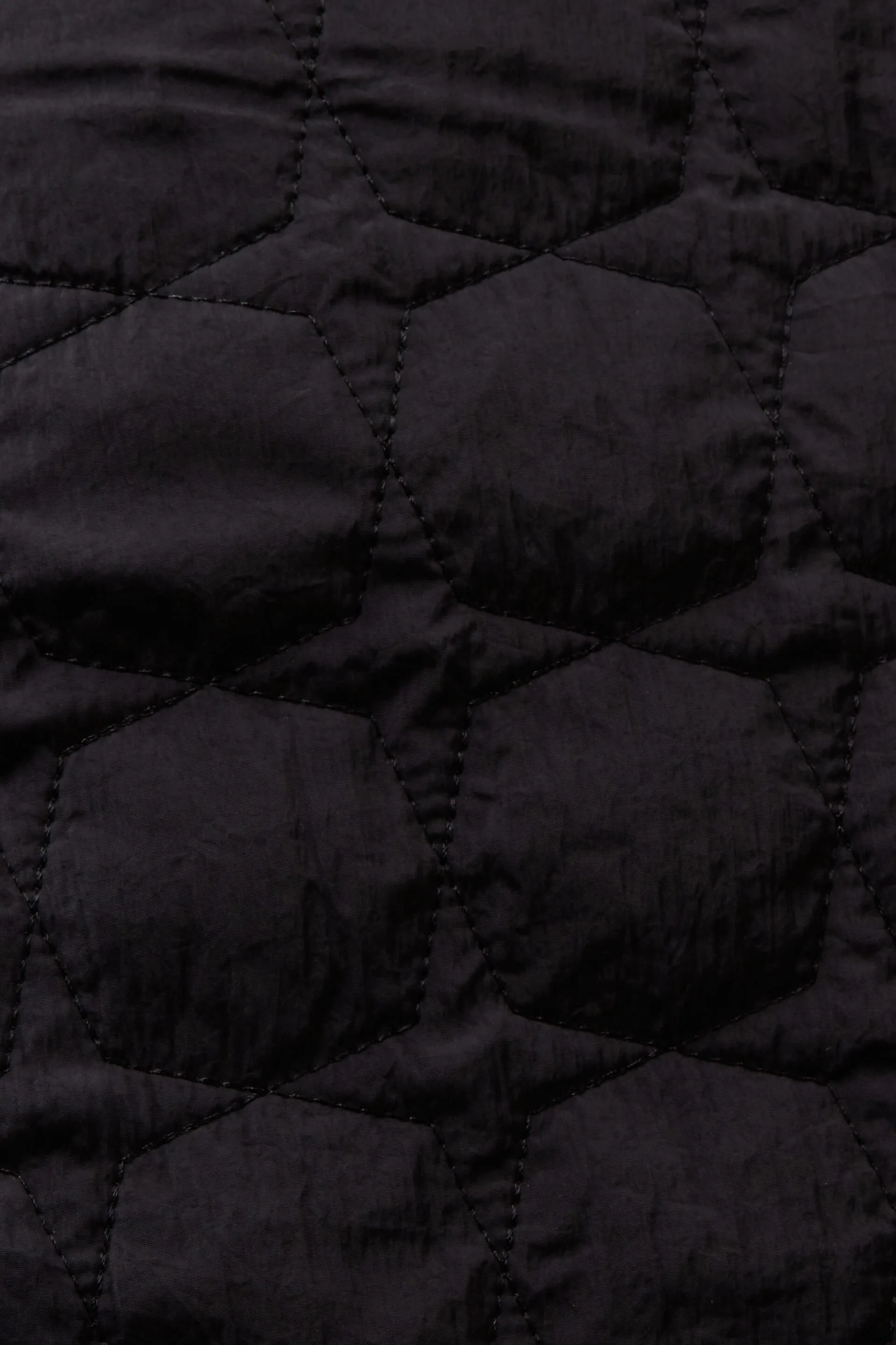 Long quilted jacket.