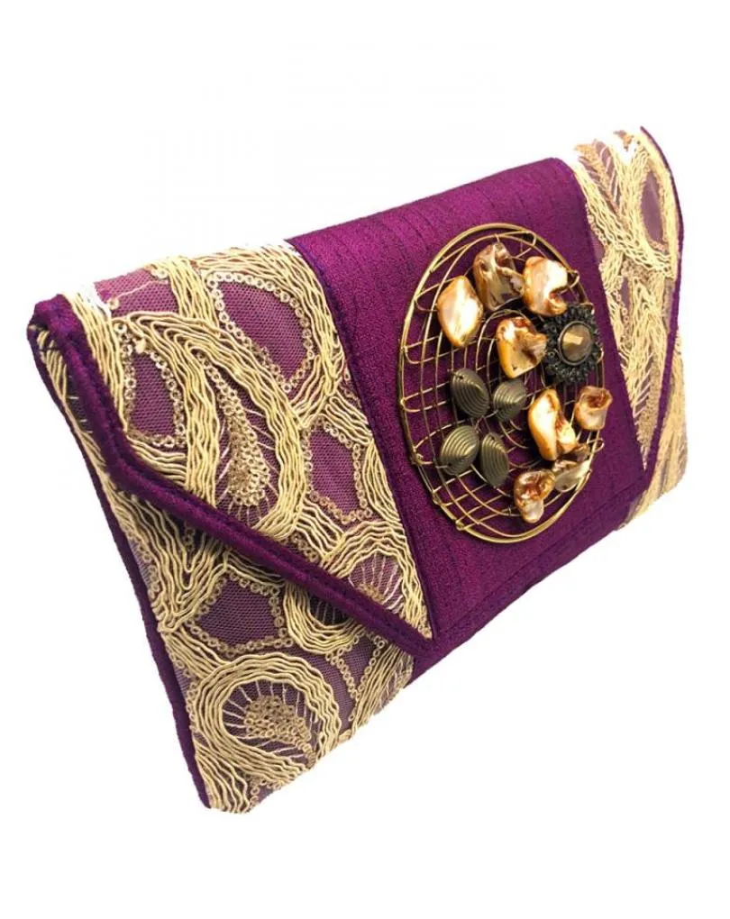 Party bags wine burdeaux and gold decorated with rhinestones.