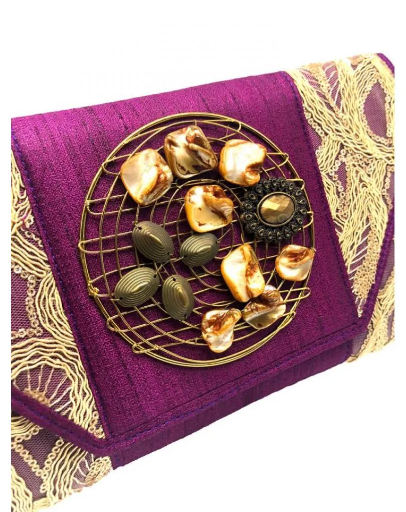 Party bags wine burdeaux and gold decorated with rhinestones.