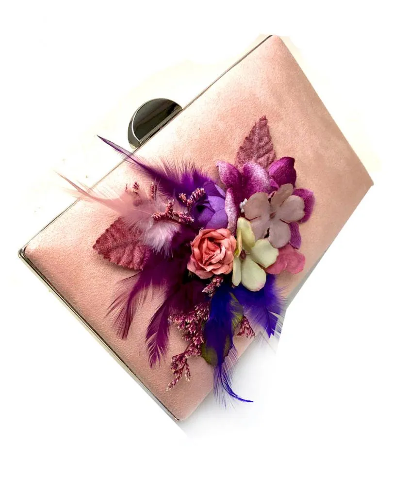 Party bags with feathers in pink, lilac, and purple