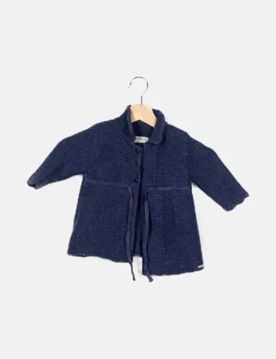 Pili Carrera blue coat with bow detail.