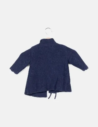 Pili Carrera blue coat with bow detail.