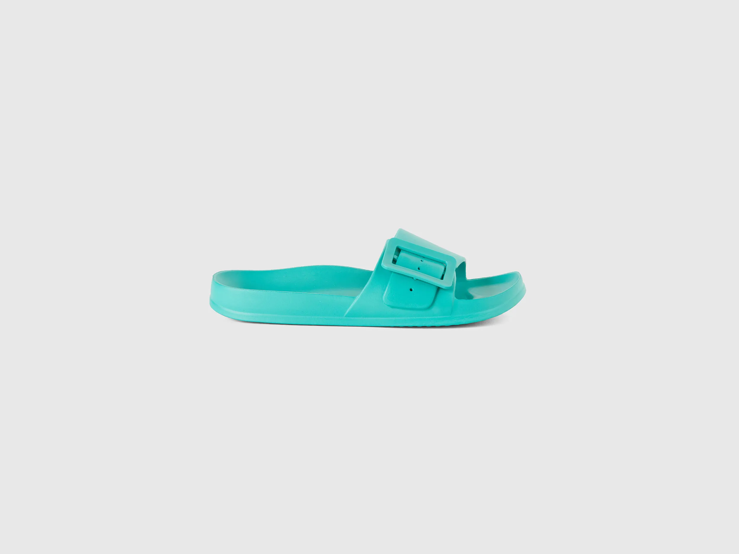 Sneakers with strap and bracelet.