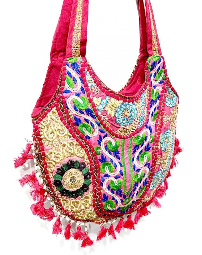Summer bags, ethnic design, embroidered fabrics from India in fuchsia color.