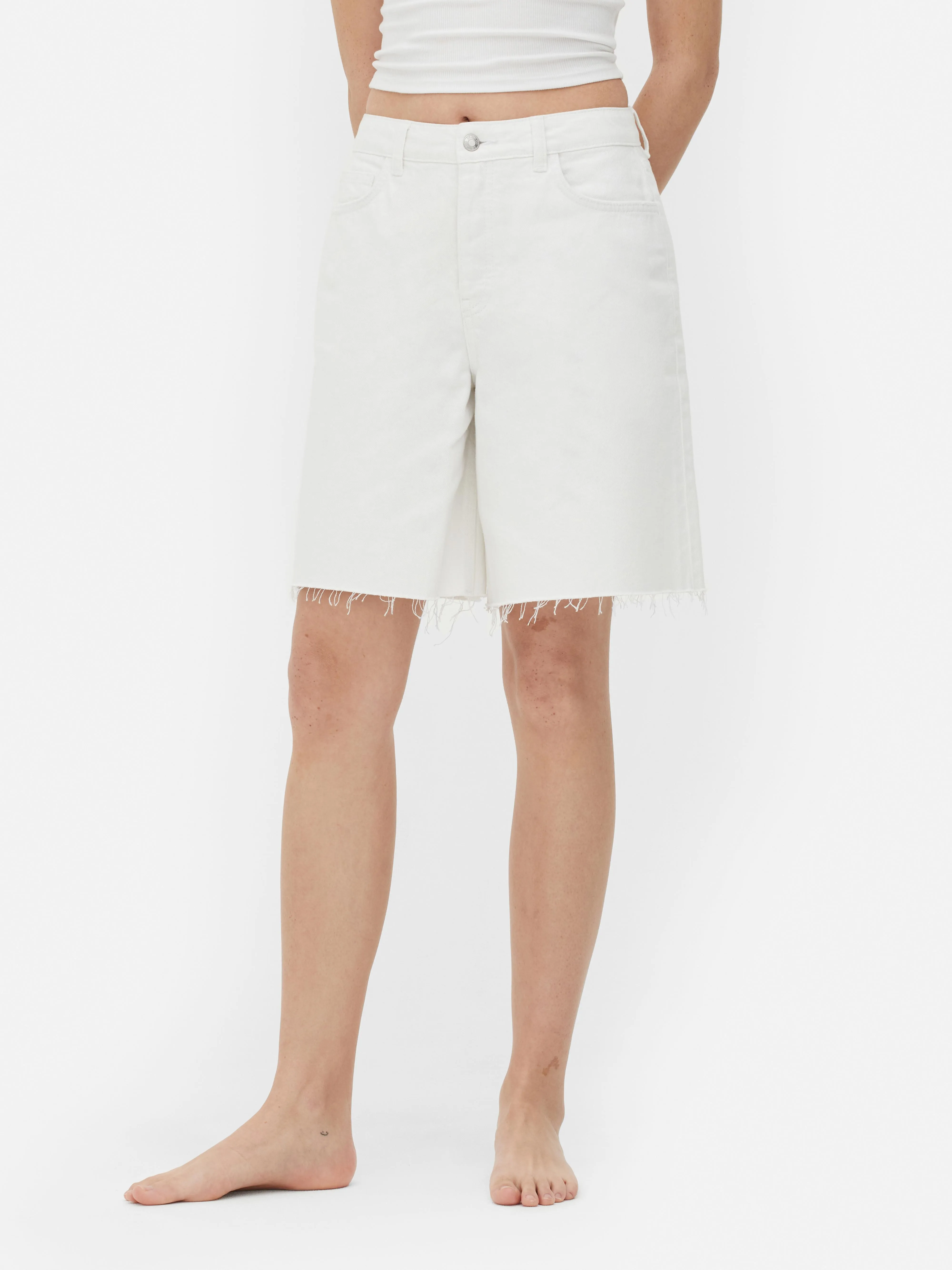 Unfinished hem denim Bermuda shorts.