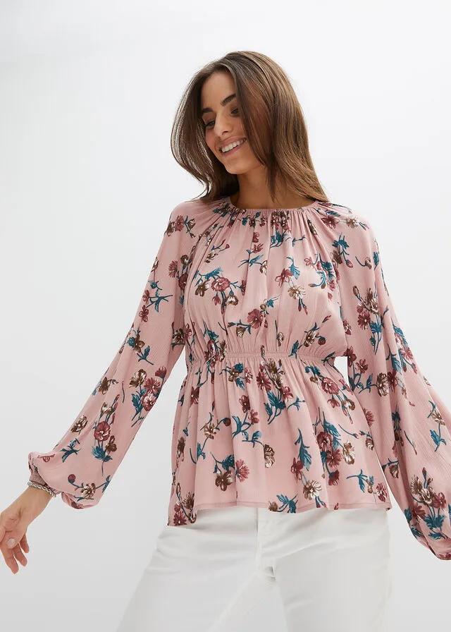 Wide pink floral blouse.