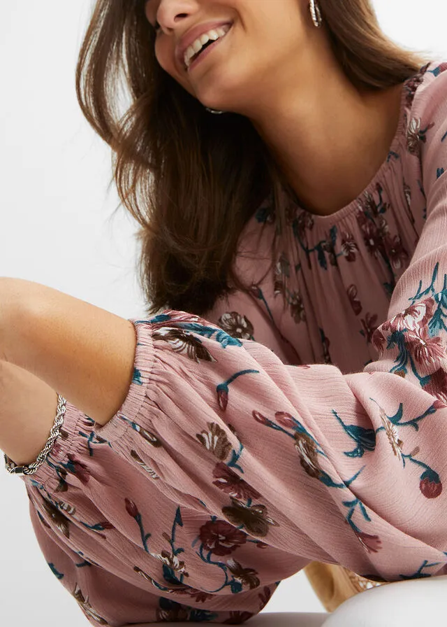 Wide pink floral blouse.