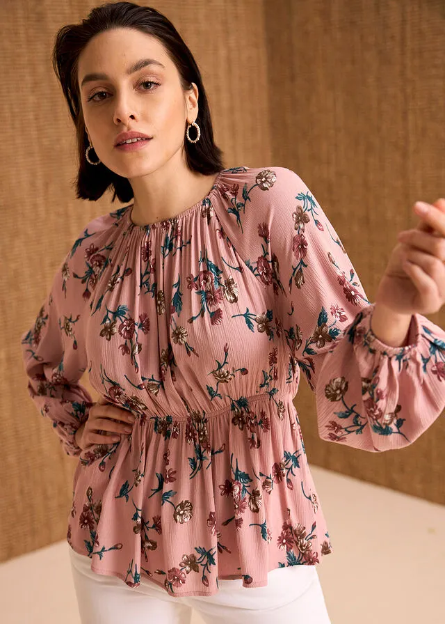 Wide pink floral blouse.